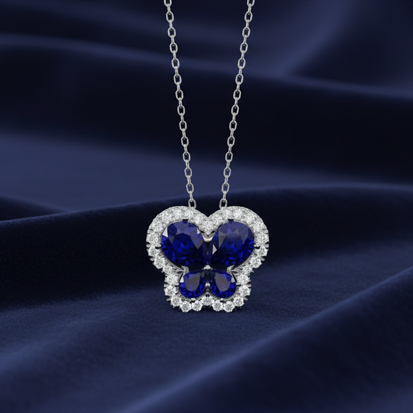 14K WHITE GOLD 1 1/5CT ROUND/PEAR DIAMOND LADIES PENDANT (CENTER STONE PEAR BLUE 1.00CT)